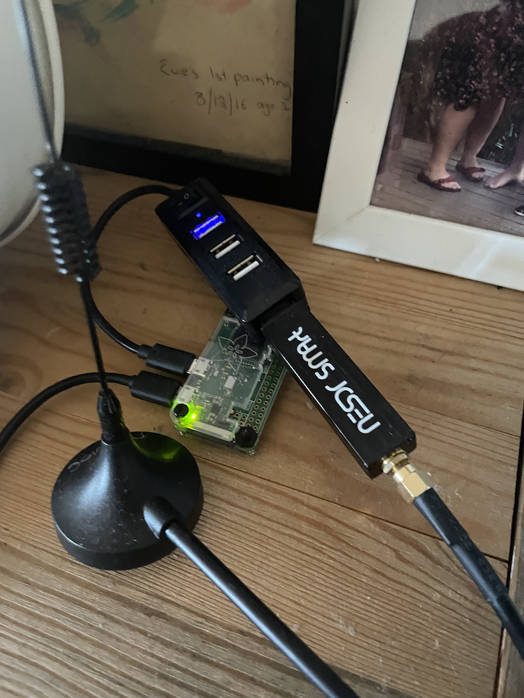 photo of a Raspberry Pi Zero with a software defined radio receiver attached by USB